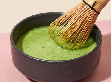Step 3, whisking matcha to a smooth green foam