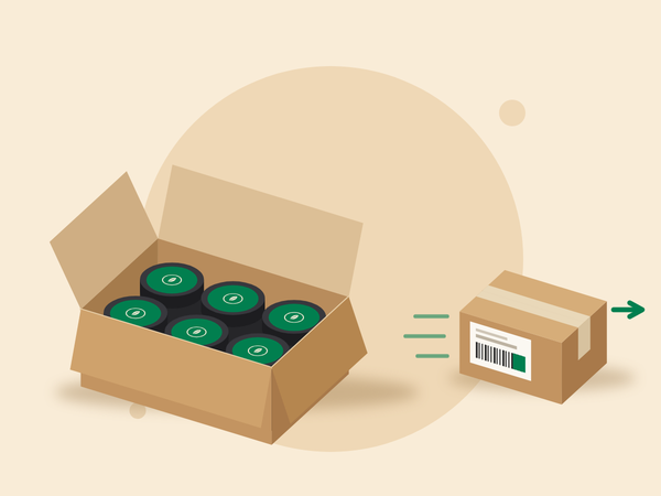 Labelled tins in an open carton, next to a closed parcel with a shipping label